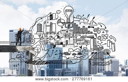 450x290 Businessman In Helmet Drawing Business Plan Strategy While - Broken Bridge Drawing