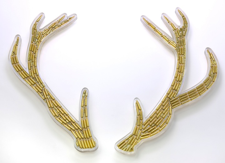 721x522 artist uses shotgun shells to create provocative art forms - Bullet Shell Drawing