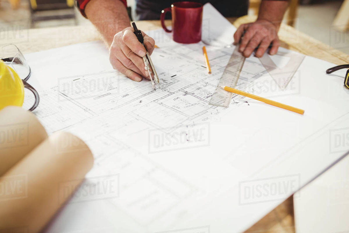 1200x800 carpenter drawing on a plan with a compass in carpentry - Carpenter Drawing