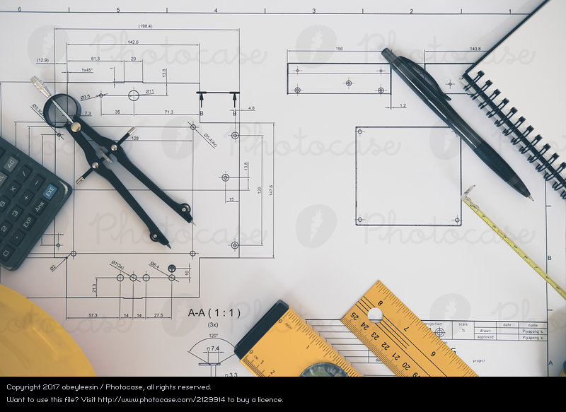 800x583 architect or planner working on drawings for construction plans - Copyright Free Drawings