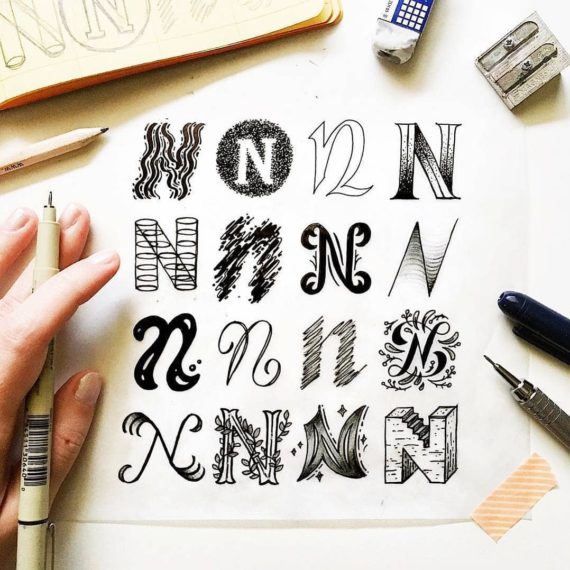 A person drawing letters.