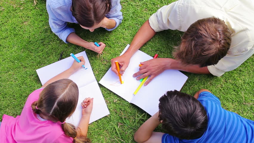 852x480 family drawing together while lying stock footage video - Drawing Together