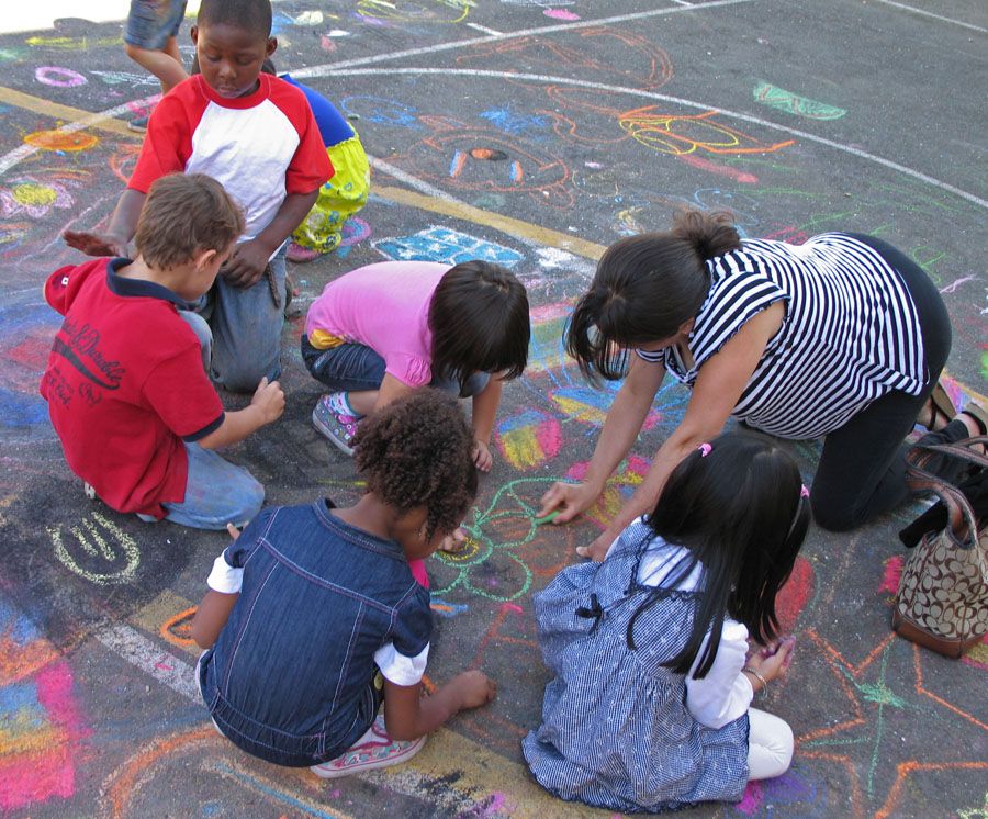 900x746 kids parents creating together drawing on earth chalk drawing - Drawing Together