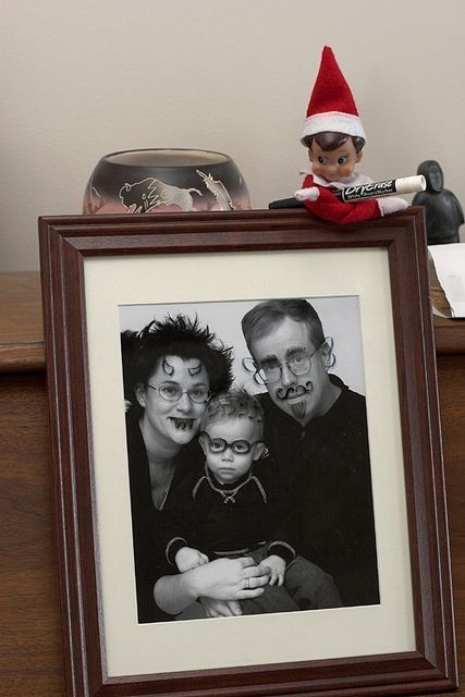 427x640 Drawing Funny Faces On Picture With Dry Erase Marker The Elf - Elf On The Shelf Drawing On Pictures