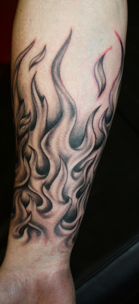 469x1024 Grey Ink Joker Skull And Flames Tattoos On Arm Tattoo Ideas - Flame Tattoo Drawings