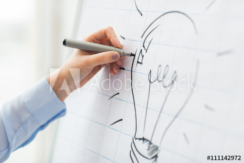 500x334 Close Up Of Hand Drawing Light Bulb On Flip Chart - Flipchart Drawing
