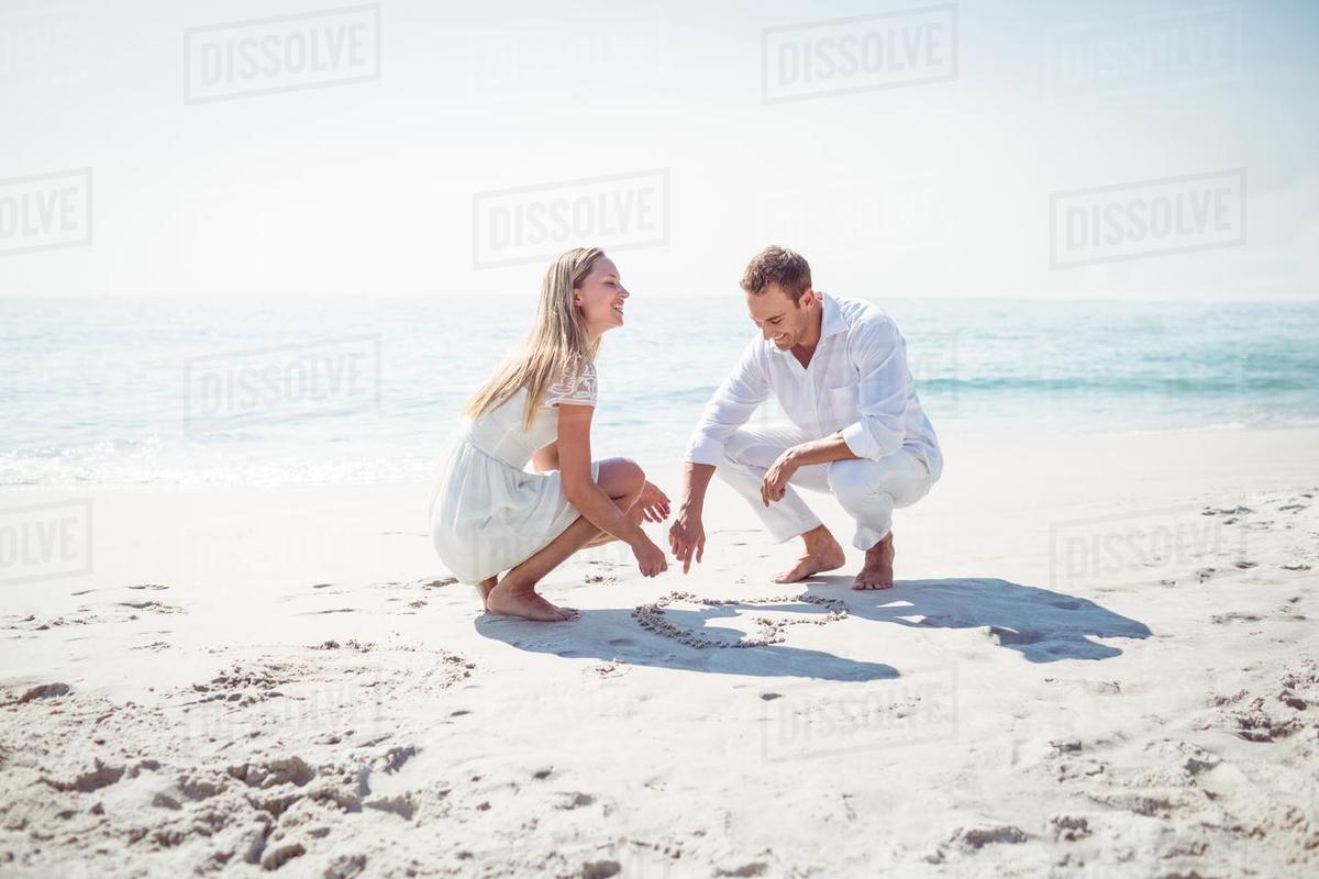 1200x800 Happy Couple Drawing Heart Shape In The Sand - Happy Couple Drawing