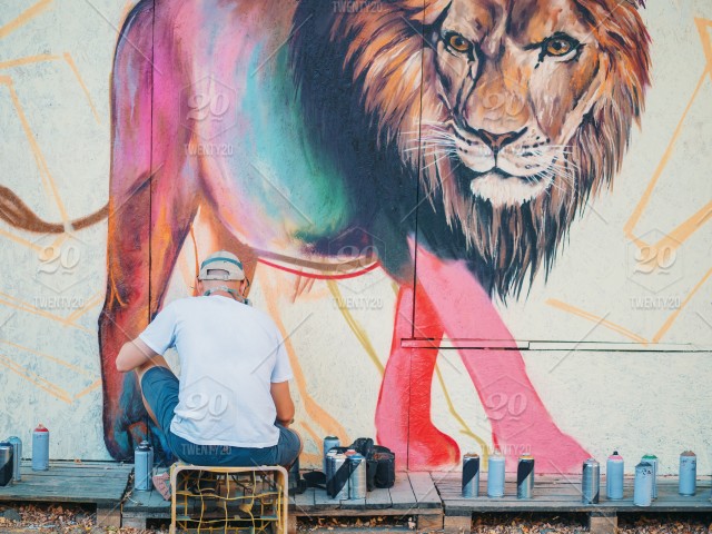 640x480 Man In Mask Drawing Lion Graffiti Art On Street Wall Stock Photo - Lion Man Drawing
