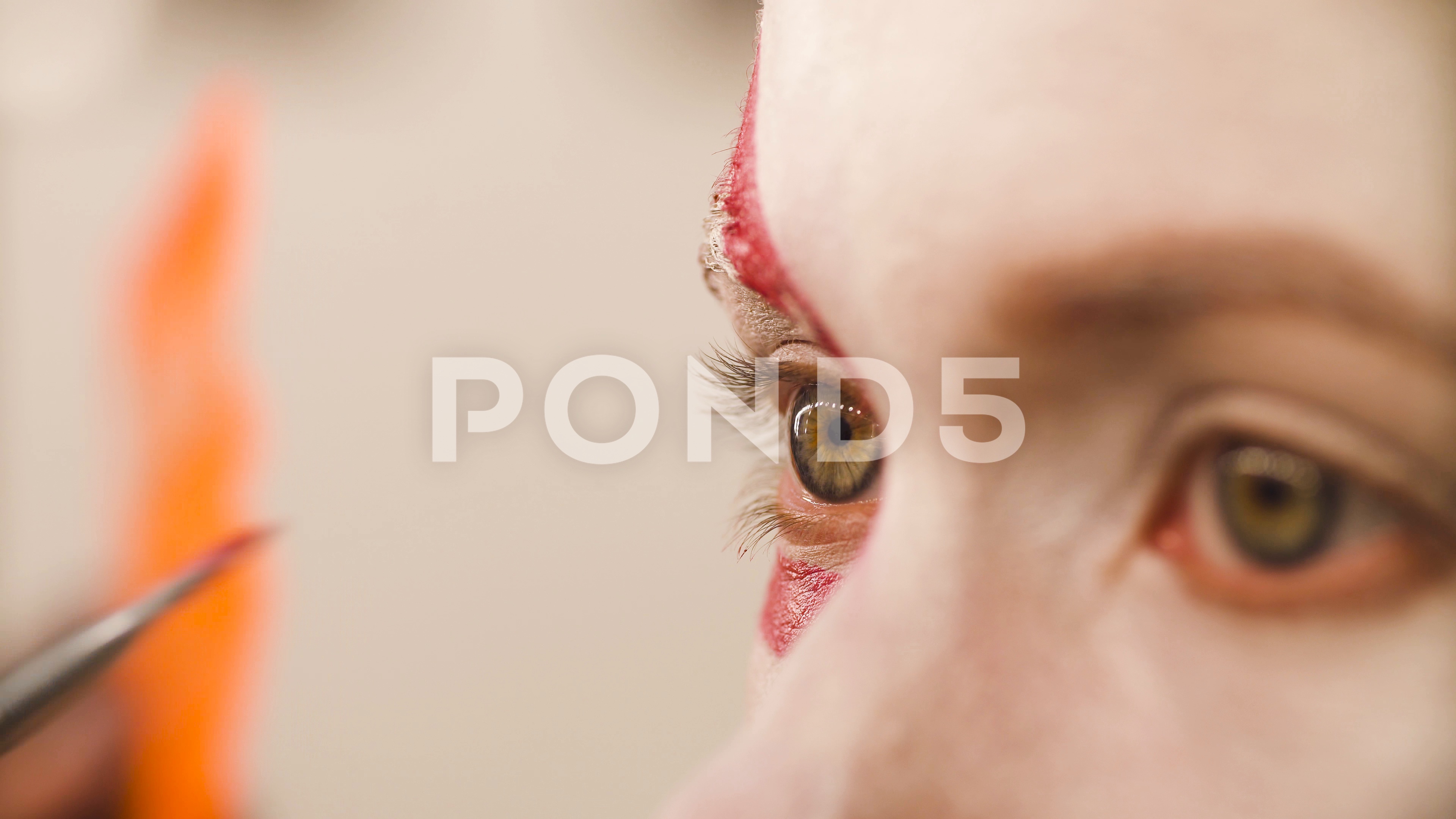 3840x2160 Makeup Artist Drawing Red Lines On The Face Footage - Makeup Artist Drawing