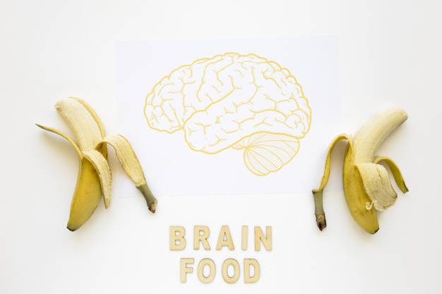 626x417 peeled bananas near brain food words with drawing on paper photo - Peeled Banana Drawing