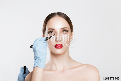 500x334 Plastic Surgery Concept Doctor Hands Drawing Marks On Female Face - Plastic Surgery Drawing
