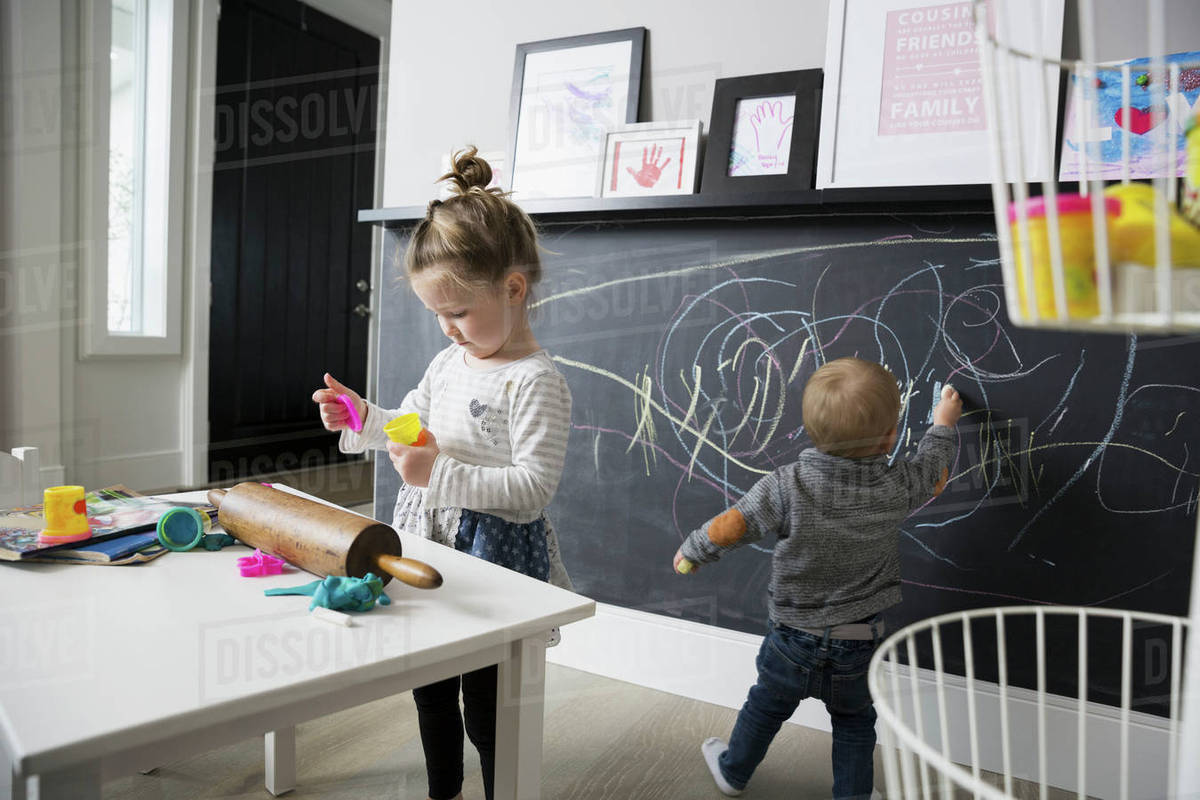 1200x800 baby boy drawing on blackboard wall with sister in playroom - Playroom Drawing