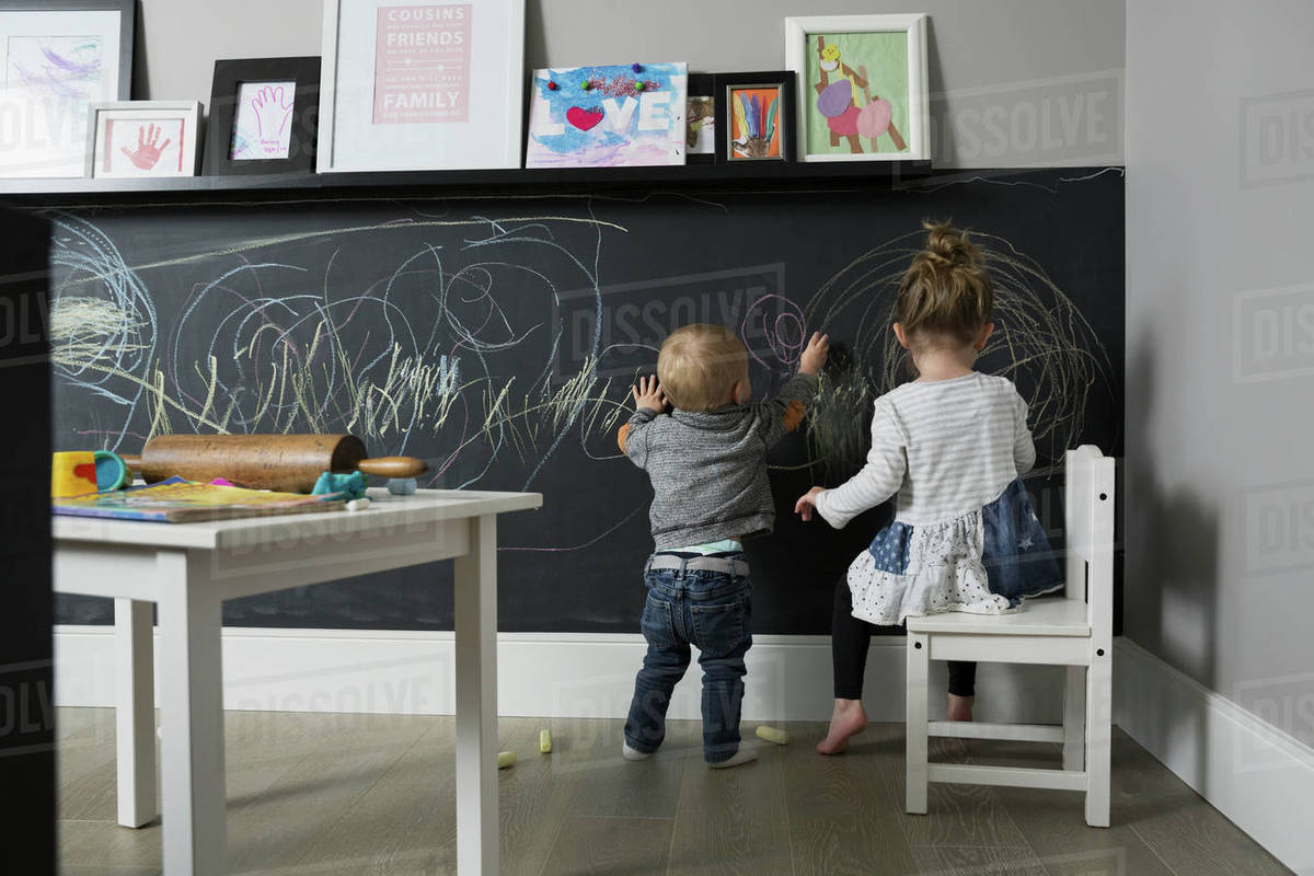 1200x800 brother and sister drawing on blackboard wall in playroom - Playroom Drawing