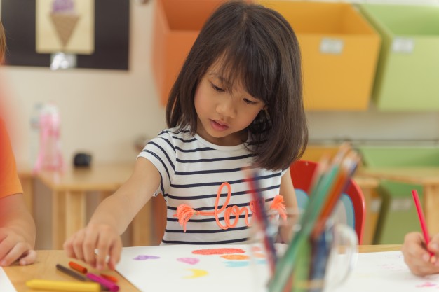 626x417 Girl Drawing Color Pencils In Kindergarten Classroom, Preschool - Preschool Children Drawing