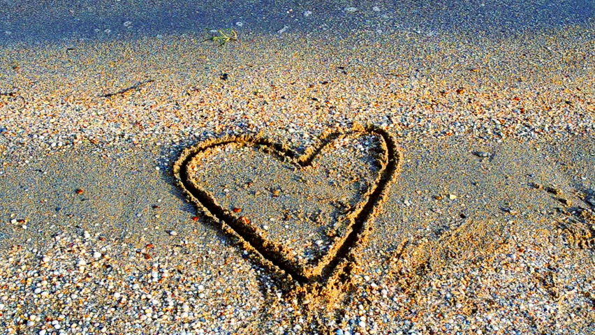 852x480 drawing heart on sand stock footage video - Sand Drawing