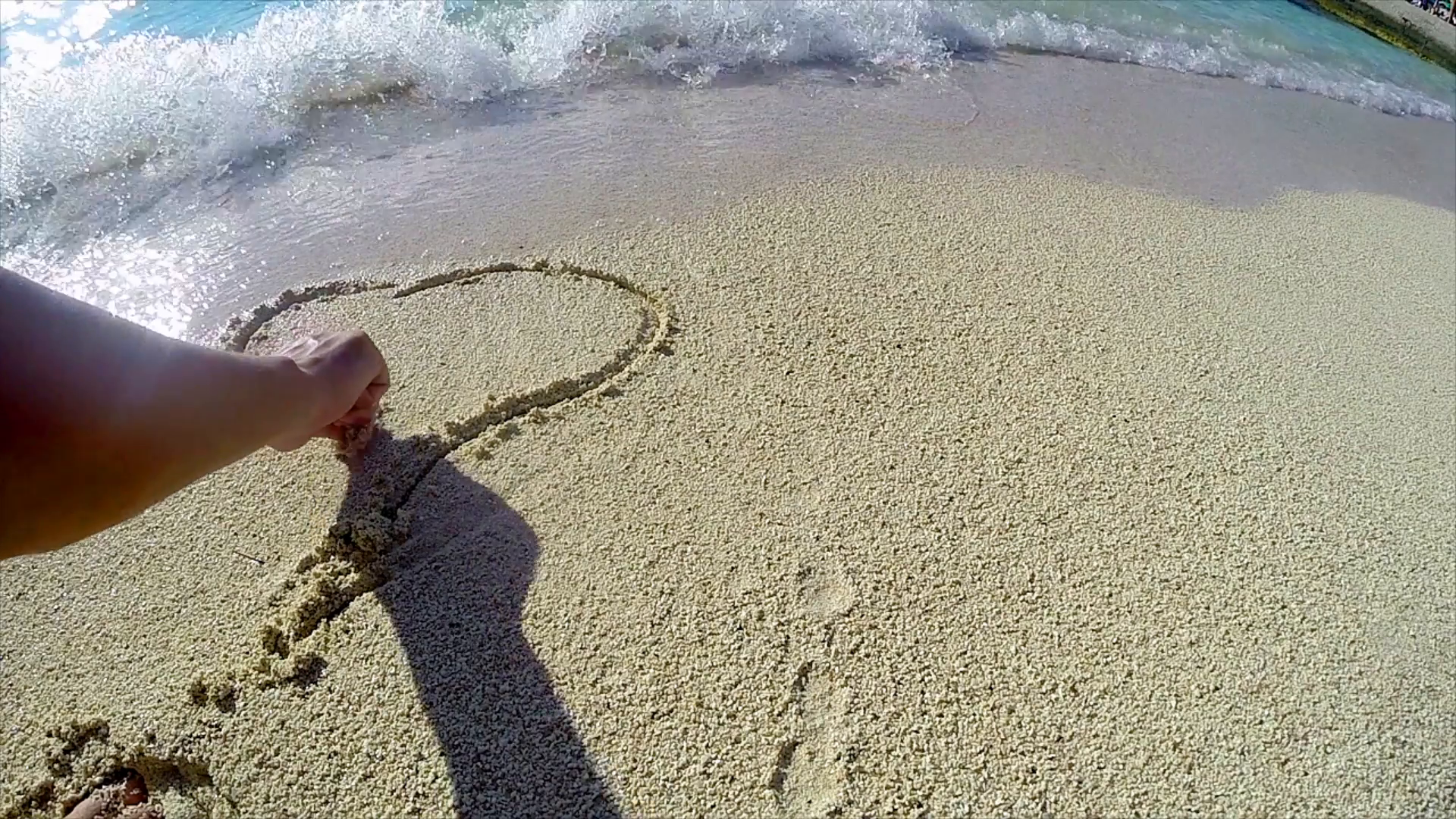 1920x1080 Drawing A Heart On The Beach Sand Washed Stock Video Footage - Sand Drawing