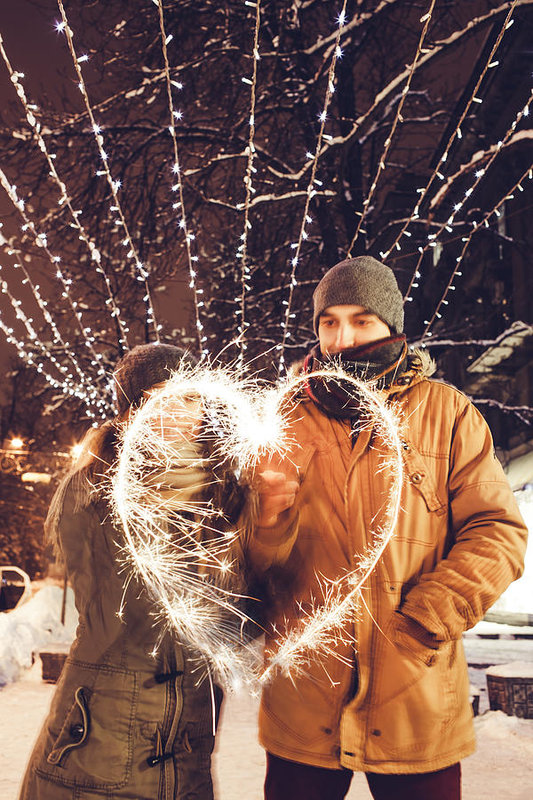 533x800 young couple drawing a heart with bengal lights under holiday - Young Couple Drawing