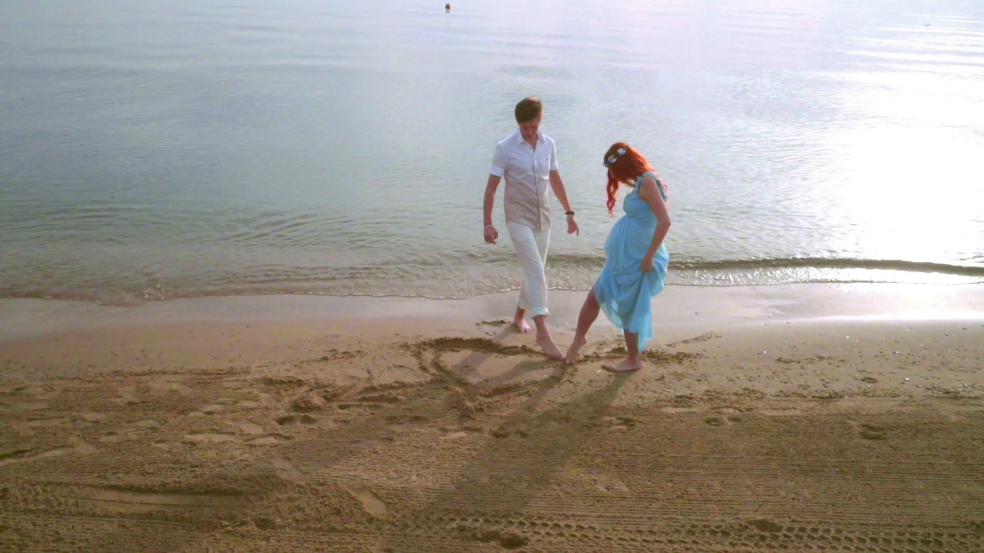 1920x1080 couple draw heart symbol on sand romantic couple drawing heart - Young Couple Drawing