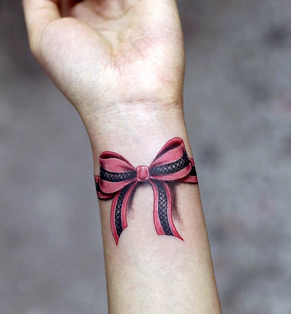 600x647 50 Eye Catching Wrist Tattoo Ideas Art And Design - Watercolor Bow Tattoo