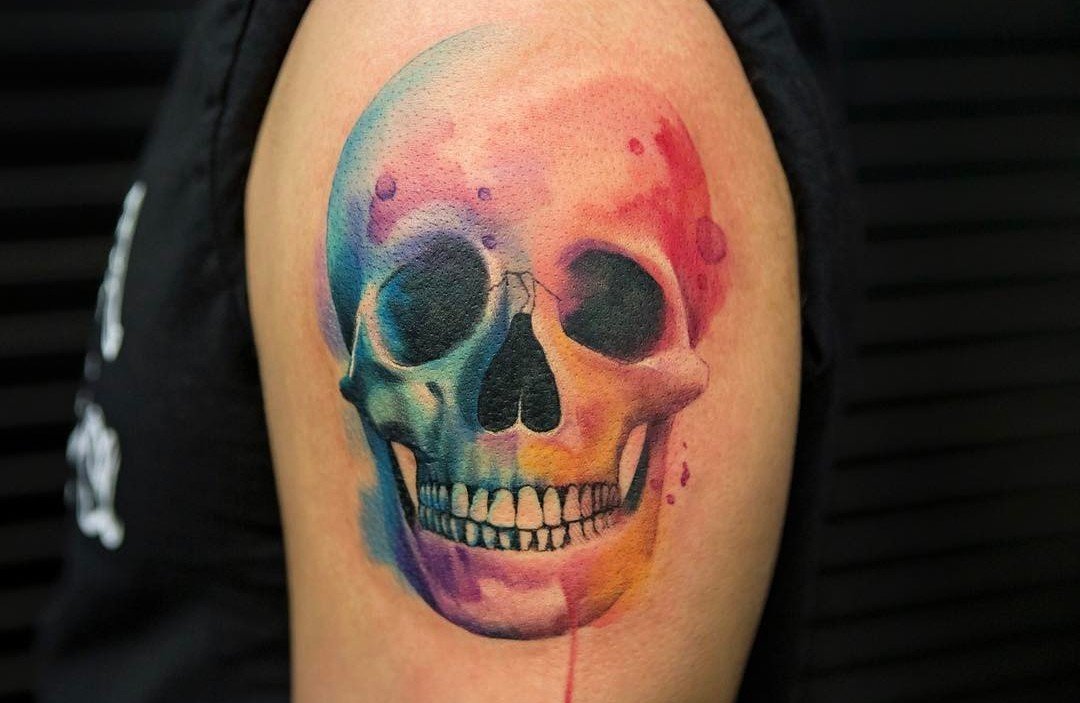 1080x703 Colorful Watercolor Skull Tattoo On Upper Arm - Watercolor Skull Tattoo