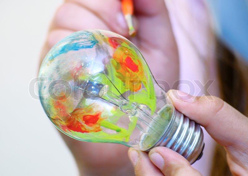 800x569 Multicolor Painting Light Bulb In Hand Stock Photo Colourbox - Bulb Painting