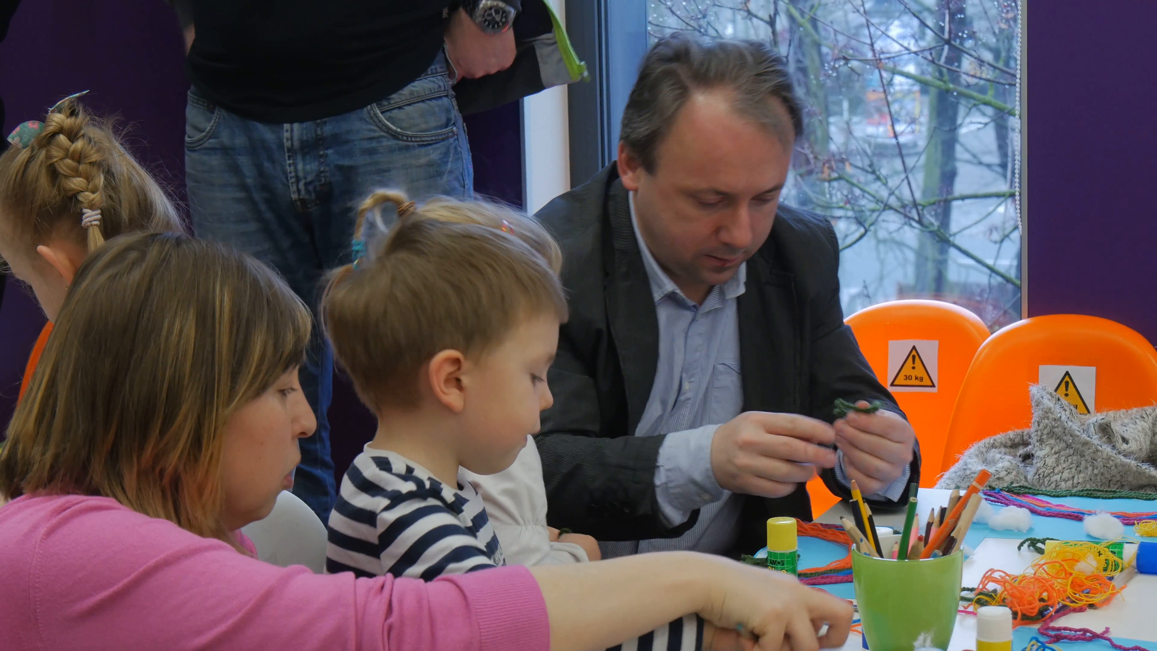 3840x2160 Young Teacher Blonde Woman Is Painting The Face Of A Boy Children - Children Painting