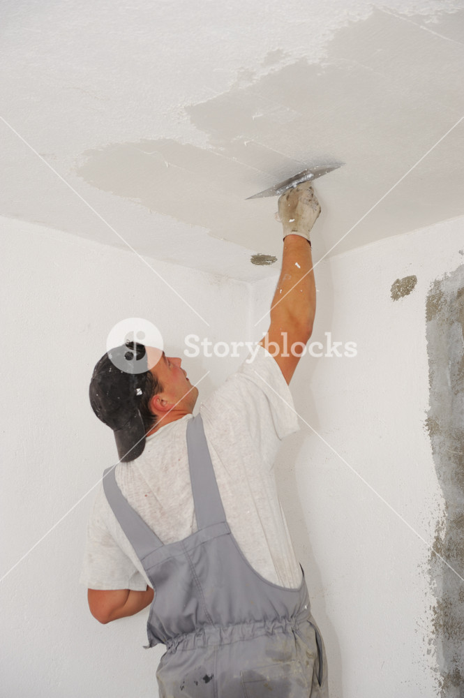 665x1000 Construction Worker Painting Walls Royalty Free Stock Image - Construction Worker Painting