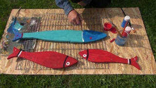 320x180 Craftsman Painting Wooden Fish For Decoration With Red Paint Stock - Craftsman Painting