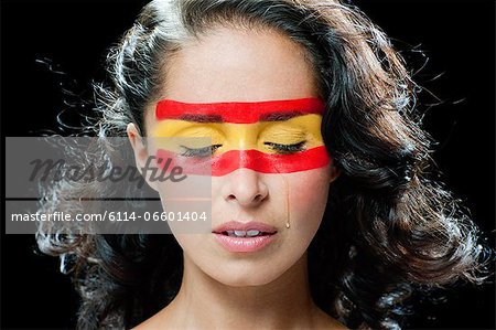 450x299 Woman With Spanish Flag Painted On Face, Crying - Crying Face Painting