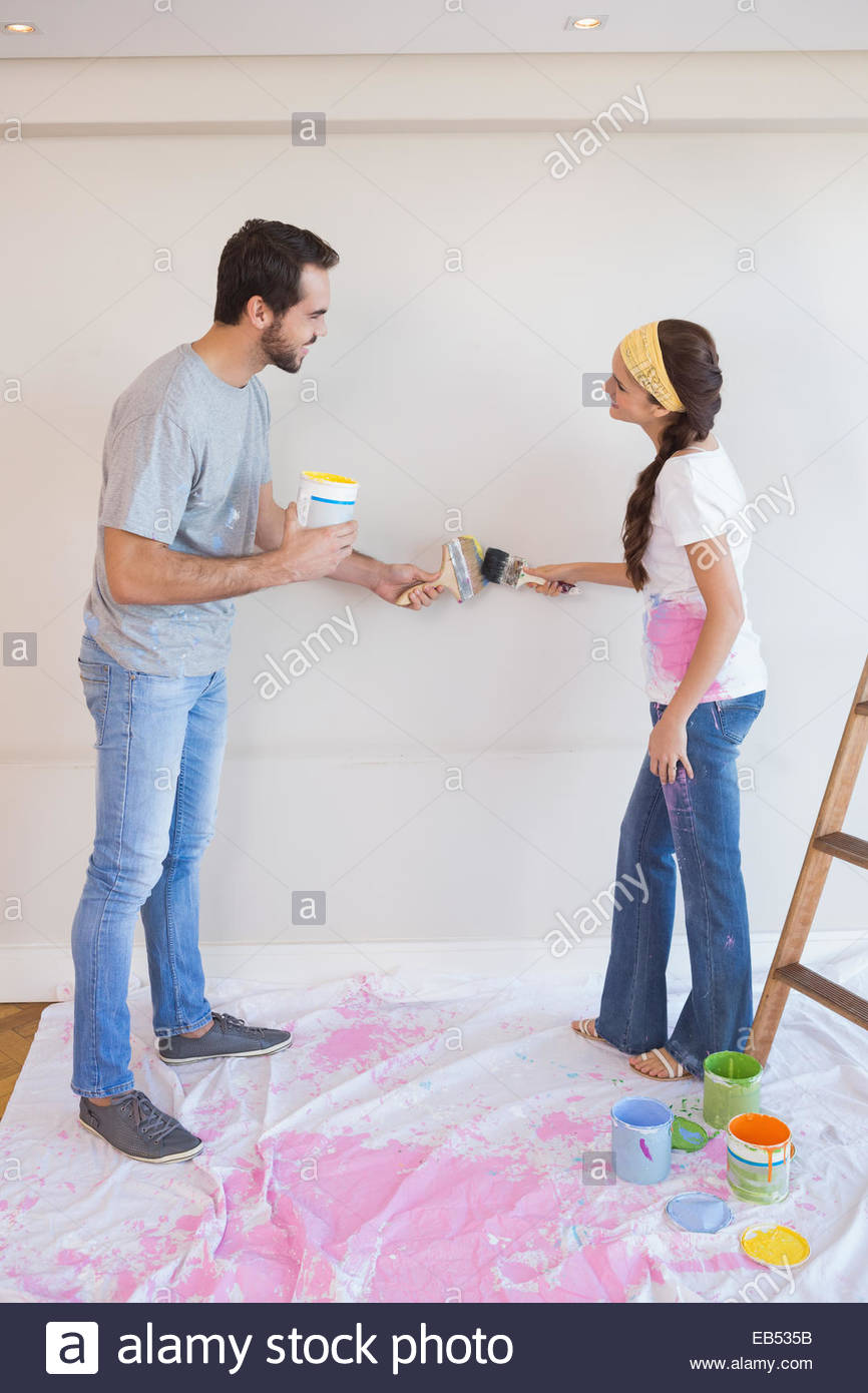 866x1390 Cute Couple Painting The Wall Stock Photo 75714951 - Cute Couple Painting