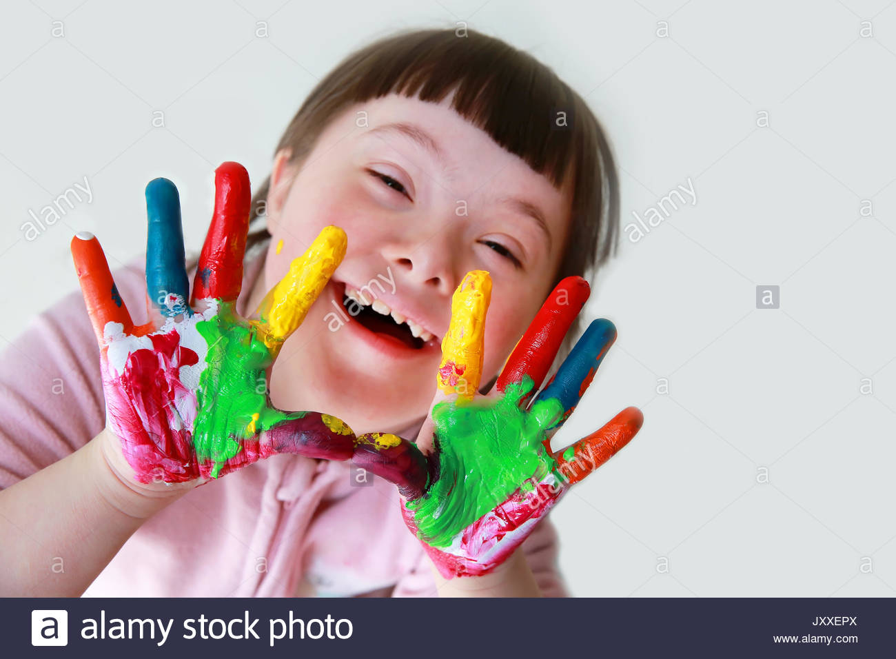 1300x956 Cute Little Down Syndrome Girl With Painted Hands Stock Photo - Down Syndrome Painting