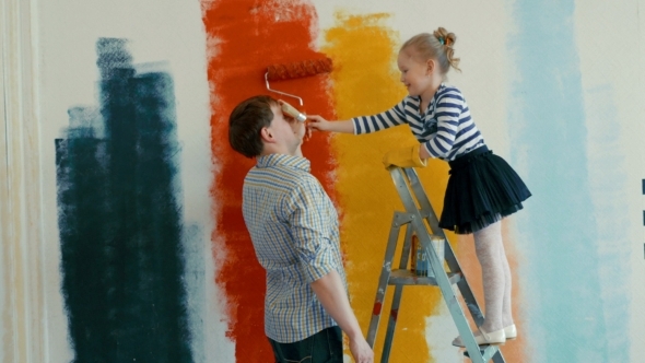 590x332 Father And Daughter Painting The Wall By Grey Coast Media Videohive - Father And Daughter Painting