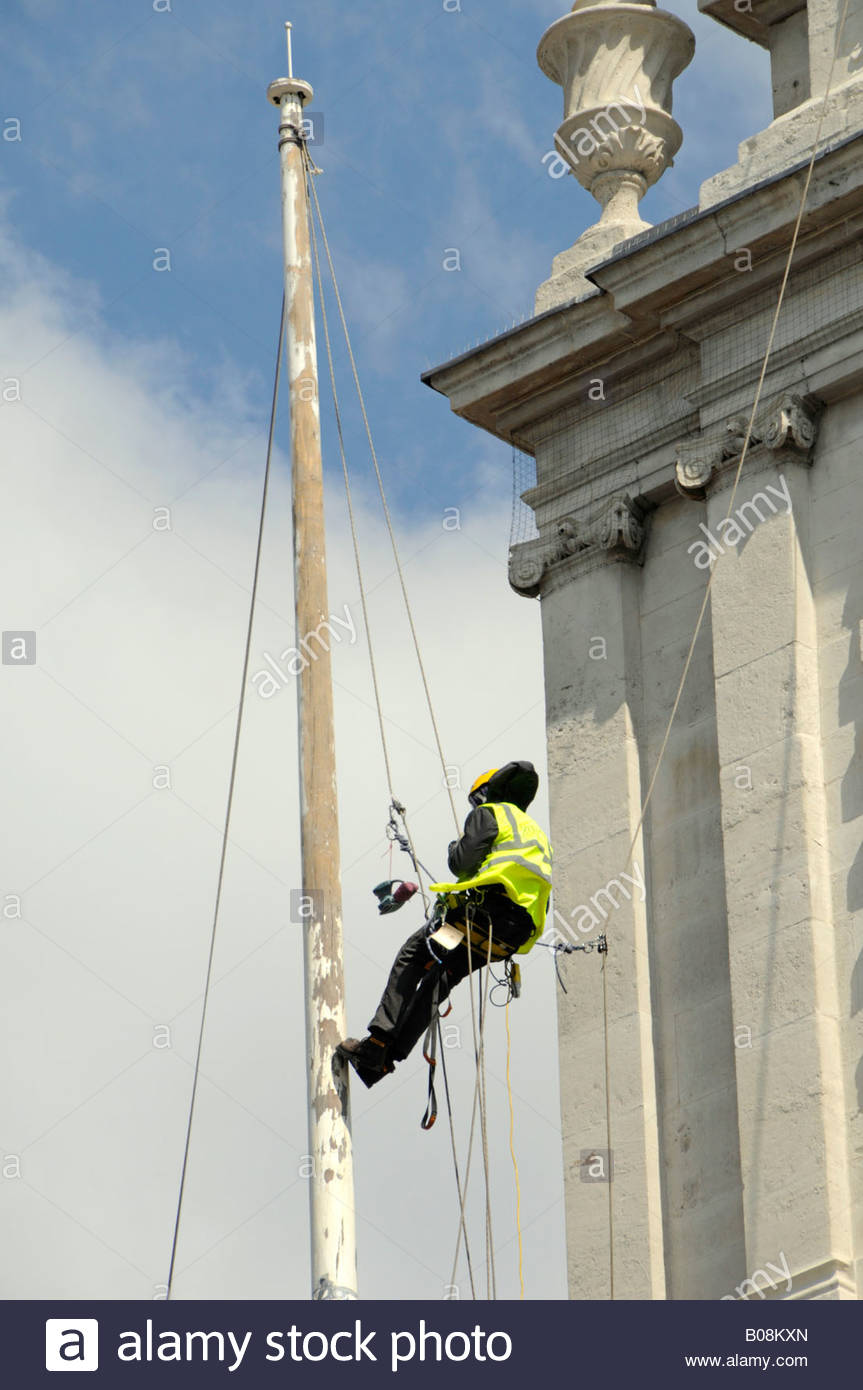 863x1390 Man Working From Chair Cradle On Flag Pole On Church Roof - Flag Pole Painting