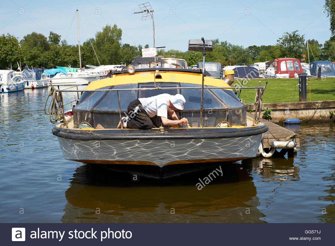 1300x956 Elderly Man Painting The Deck Of A Houseboat, Norfolk Broads Stock - Houseboat Painting