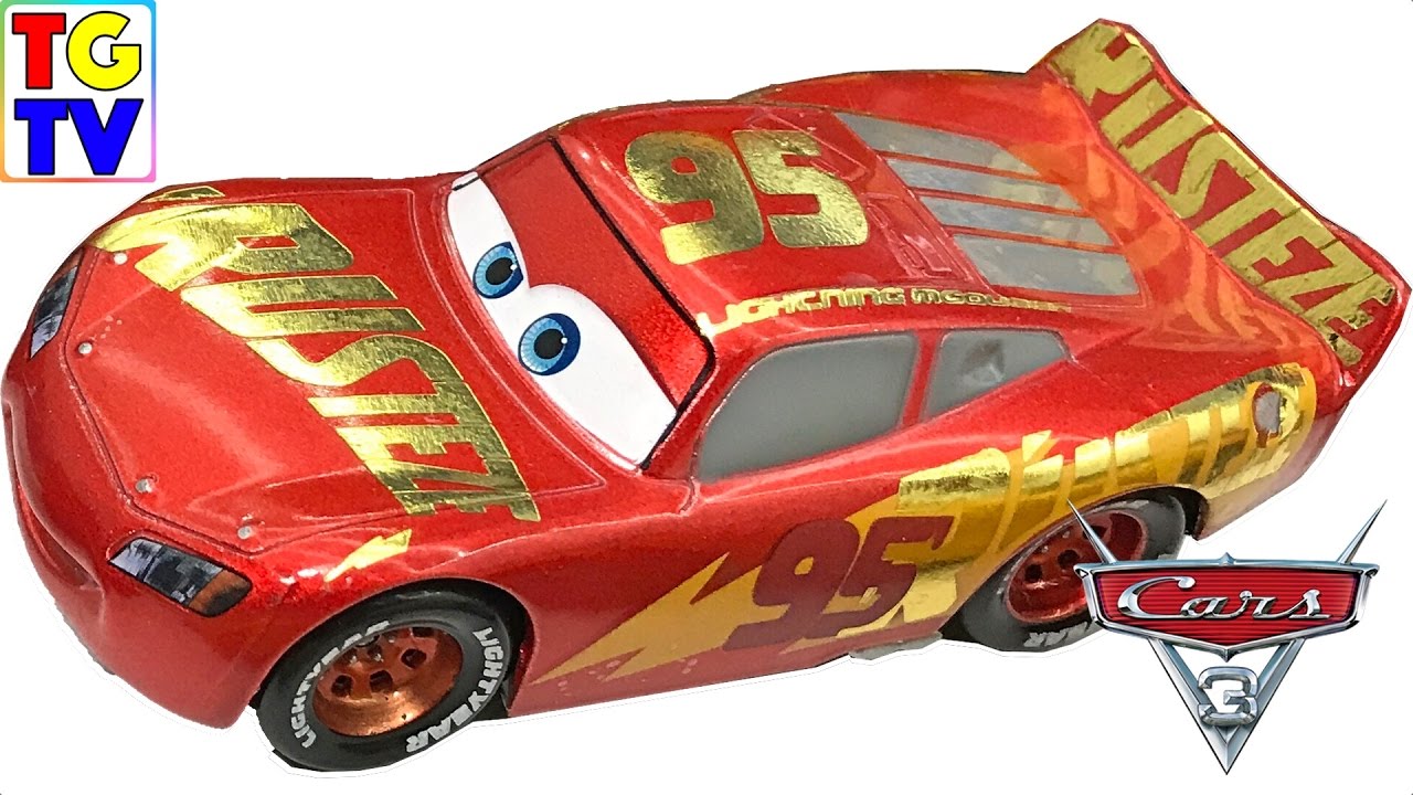 Колеса молнии маквин. Молния Маккуин Тачки 3. Cars 3 Toys Lightning MCQUEEN Gold. Молния Маккуин игрушки золотой.