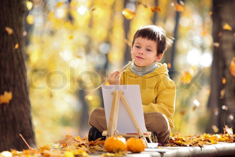 800x533 Cute Little Boy Painting In Golden Autumn Park Stock Photo - Little Boy Painting