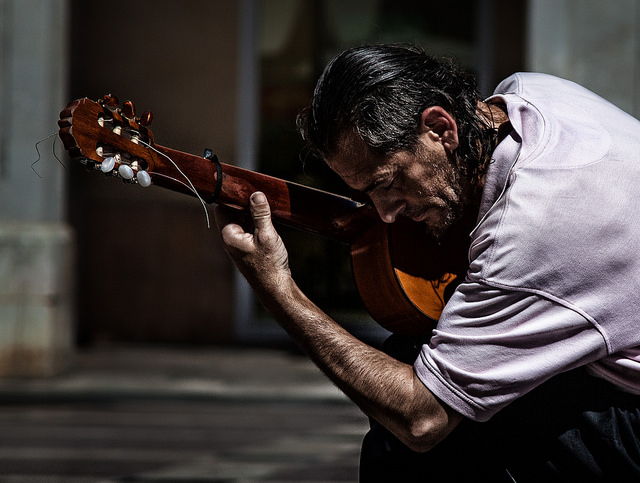 640x483 Unleash Your Creativity Learn To Play The Guitar - Man With Guitar Painting