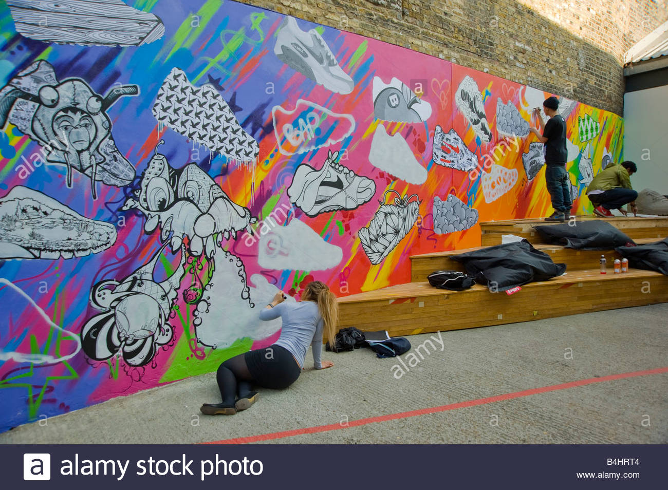 1300x954 Young People Painting A Large Mural Of Nike 90 Trainers On A Wall - Nike Painting