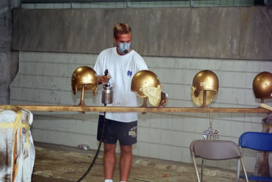 550x367 Notre Dame Football Team Will Don The New Gold Helmets - Notre Dame Football Painting