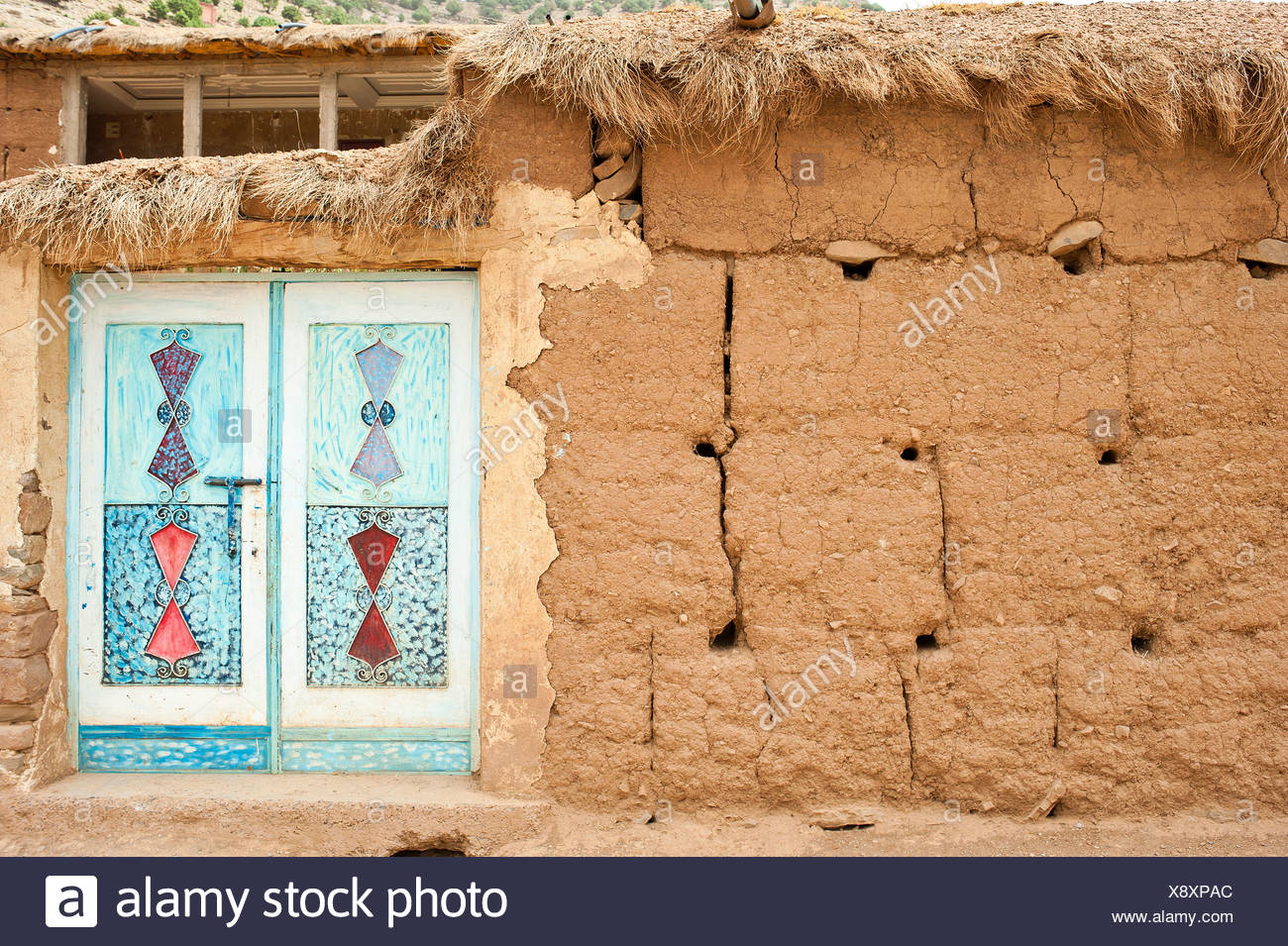 1300x955 Painted Mud House Stock Photos Amp Painted Mud House Stock Images - Painting Adobe Brick