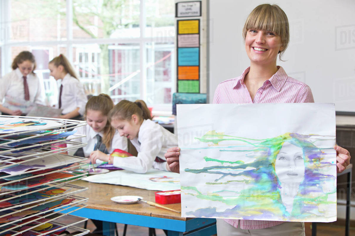 1200x800 Portrait Smiling Art Teacher Showing Painting In Art Class - Painting Teacher