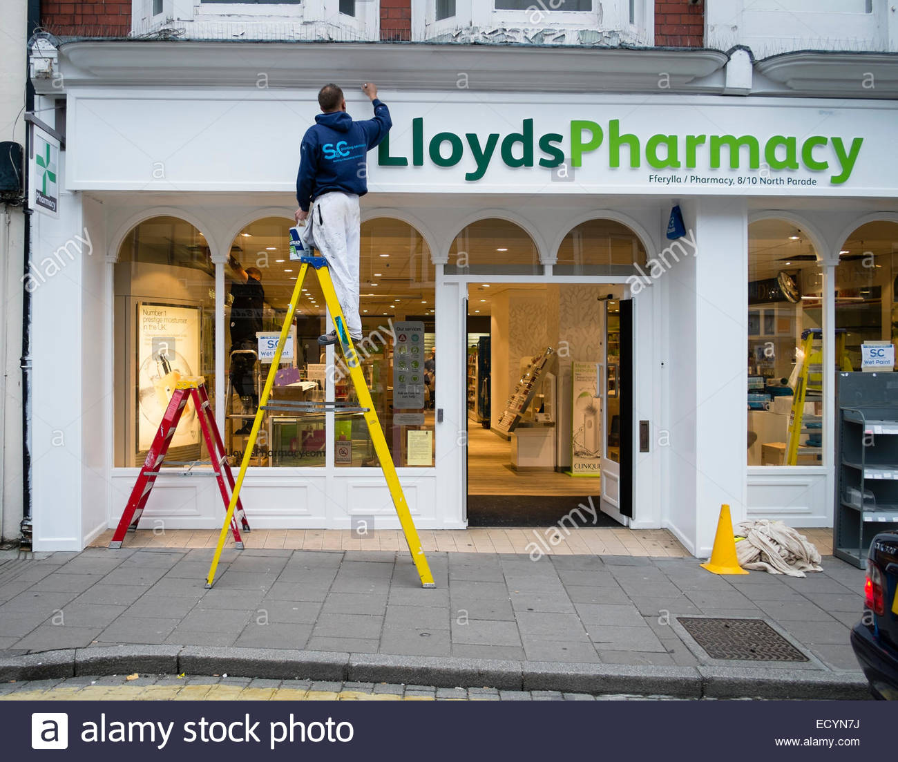 1300x1103 Wet Paint A Painter Standing On A Stepladder Painting - Pharmacy Painting