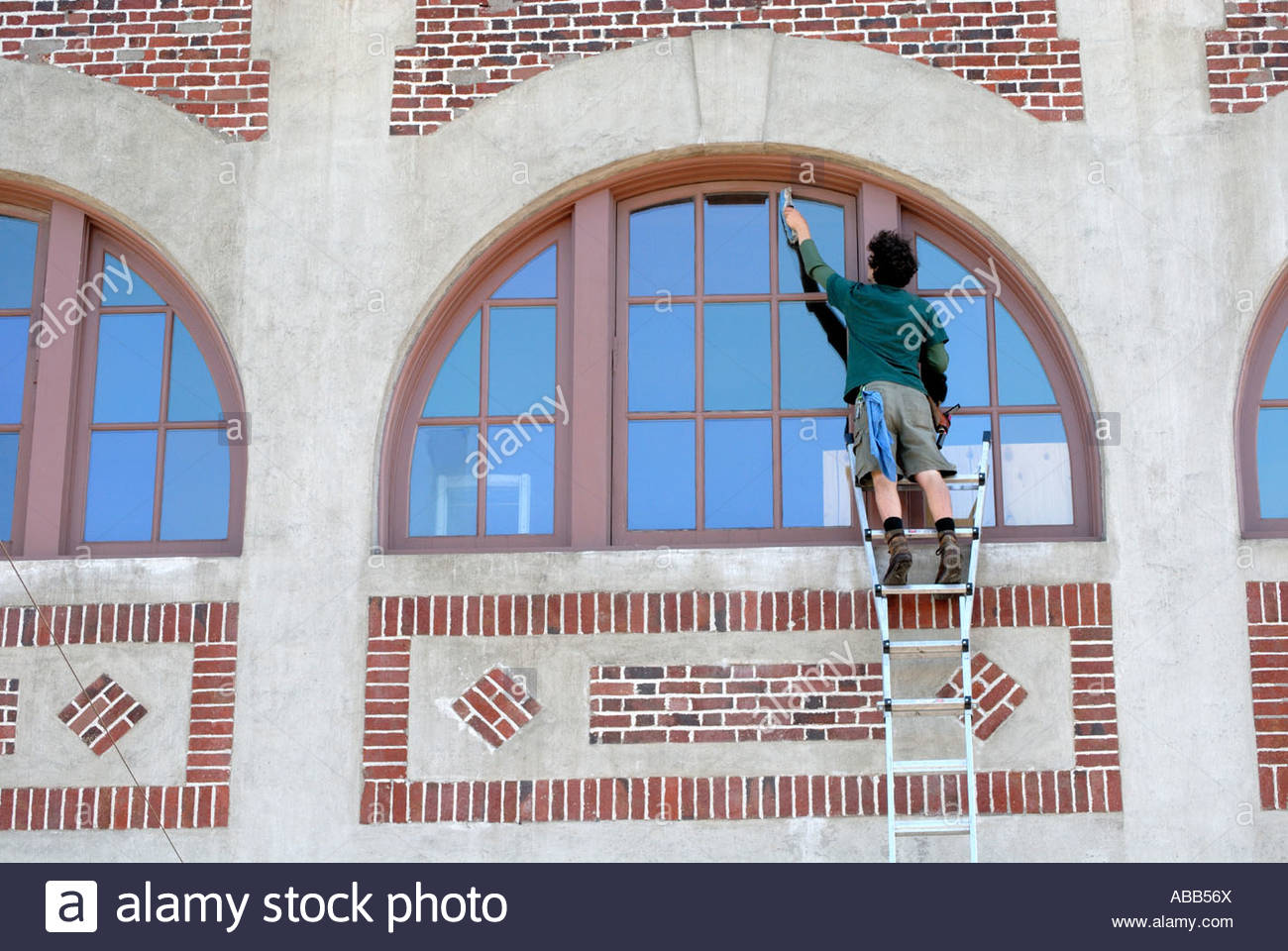 1300x960 Man Painting The Outside Of A Building Near Pike Place Market - Pike Place Market Painting