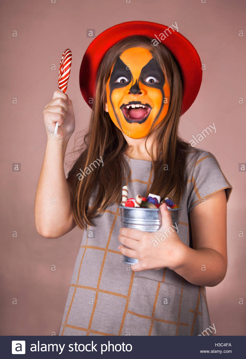 953x1390 Pretty Girl With Face Painting Of A Pumpkin. Halloween Theme Stock - Pretty Girl Painting