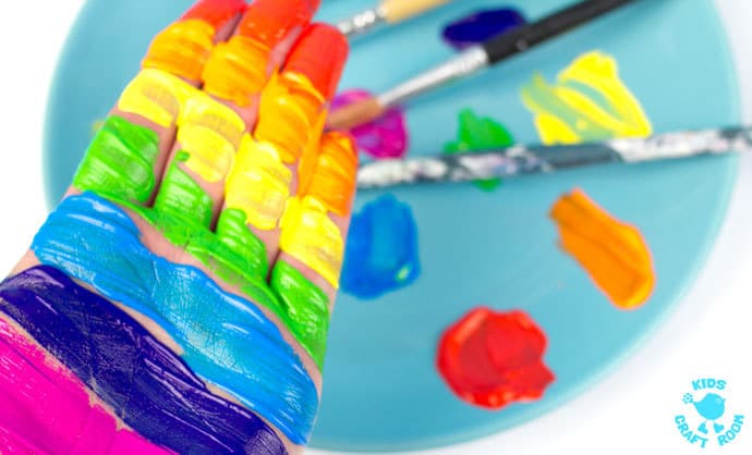 690x418 Handprint Rainbow Painting Step 1 - Rainbow Painting For Kids