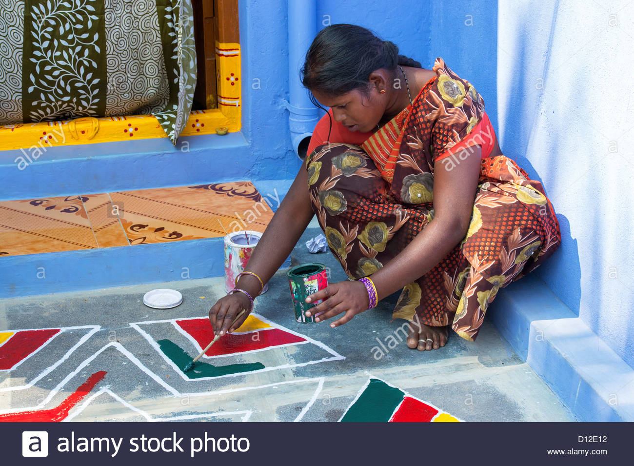 1300x955 Young Indian Woman Painting A Rangoli Design Outside A Rural - Rangoli Painting