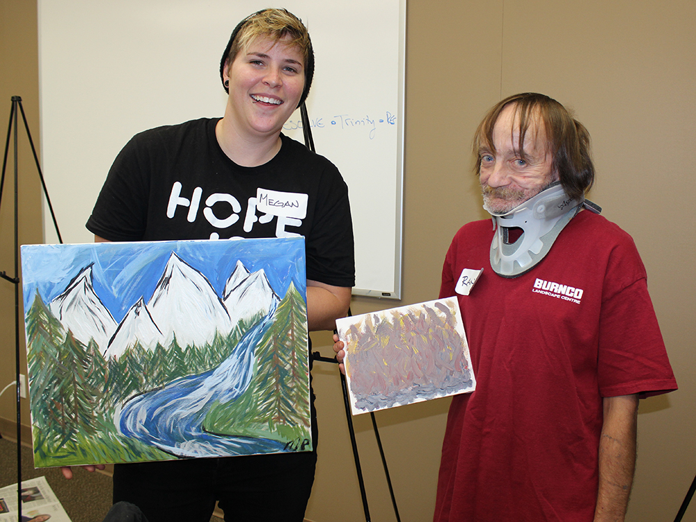 1000x750 Megan, Left, And Randy From Alpha House Hold Up The Paintings They - Up House Painting