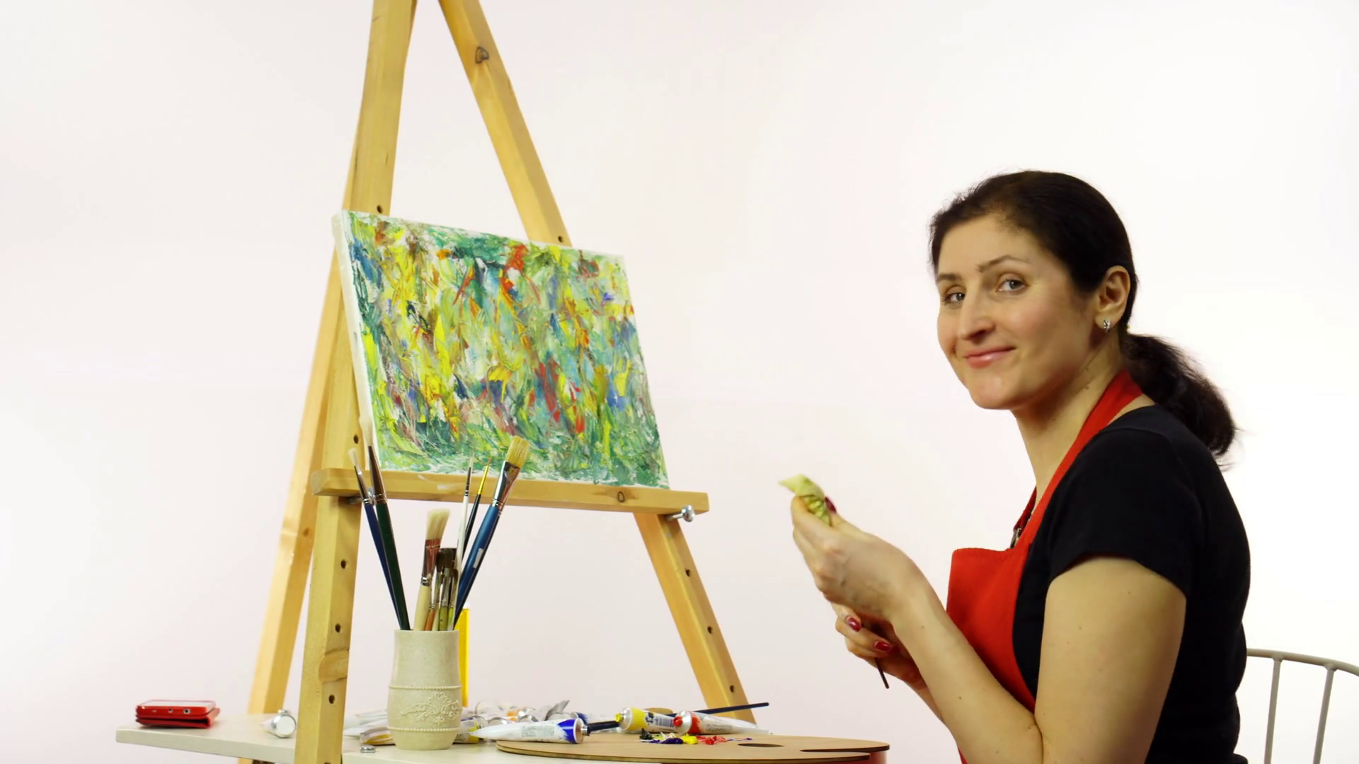 1920x1080 Woman Artist Painting With Paintbrush. The Woman Draws A Picture - Woman Artist Painting
