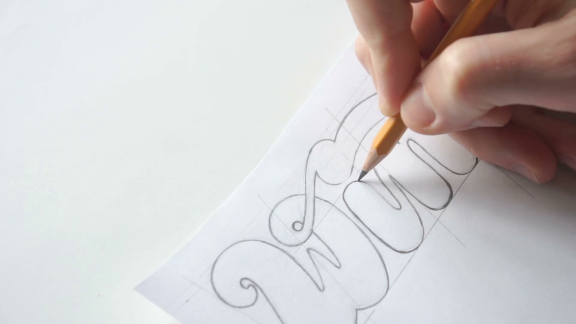 1920x1080 Lettering Or Logo Creating With A Pen On White Paper - Pen And Paper Sketch