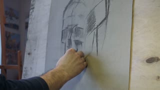 320x180 Drawing A Human Skull. The Artist Draws A Sketch Of A Human Skull - Plaster Sketch